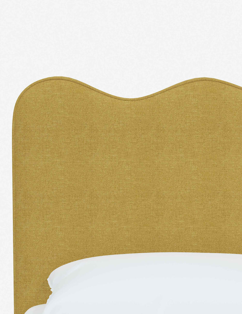 #color::golden-linen #size::twin #size::full #size::queen #size::king #size::cal-king | Close-up of the undulating lines on the headboard of the Clementine golden linen platform bed