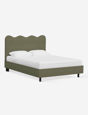 Angled view of Clementine sage linen platform bed with undulating lined headboard