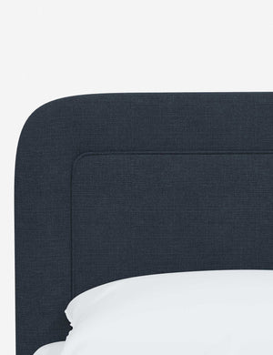 Close up of the rounded corners and interior welt border on the Gwendolyn Navy Linen Platform Bed