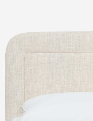 Close up of the rounded corners and interior welt border on the Gwendolyn Talc Linen Platform Bed