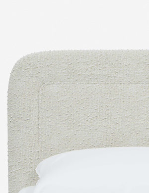 Close up of the rounded corners and interior welt border on the Gwendolyn White Boucle Platform Bed