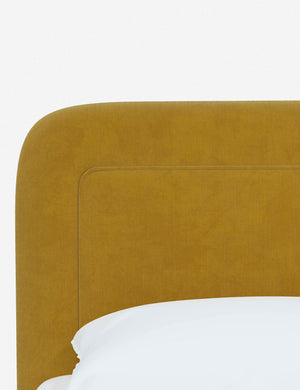 Close up of the rounded corners and interior welt border on the Gwendolyn Citronella Velvet Platform Bed