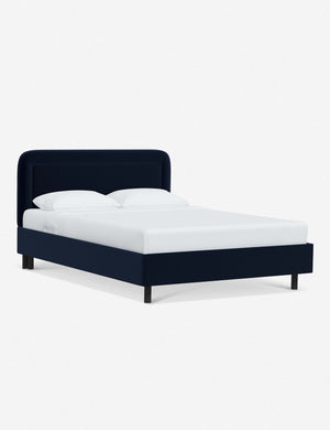Angled view of the Gwendolyn Navy Velvet Platform Bed