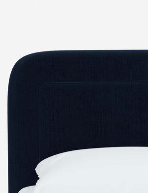 Close up of the rounded corners and interior welt border on the Gwendolyn Navy Velvet Platform Bed