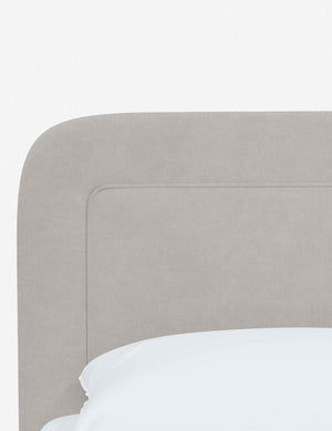 Close up of the rounded corners and interior welt border on the Gwendolyn Mineral Velvet Platform Bed