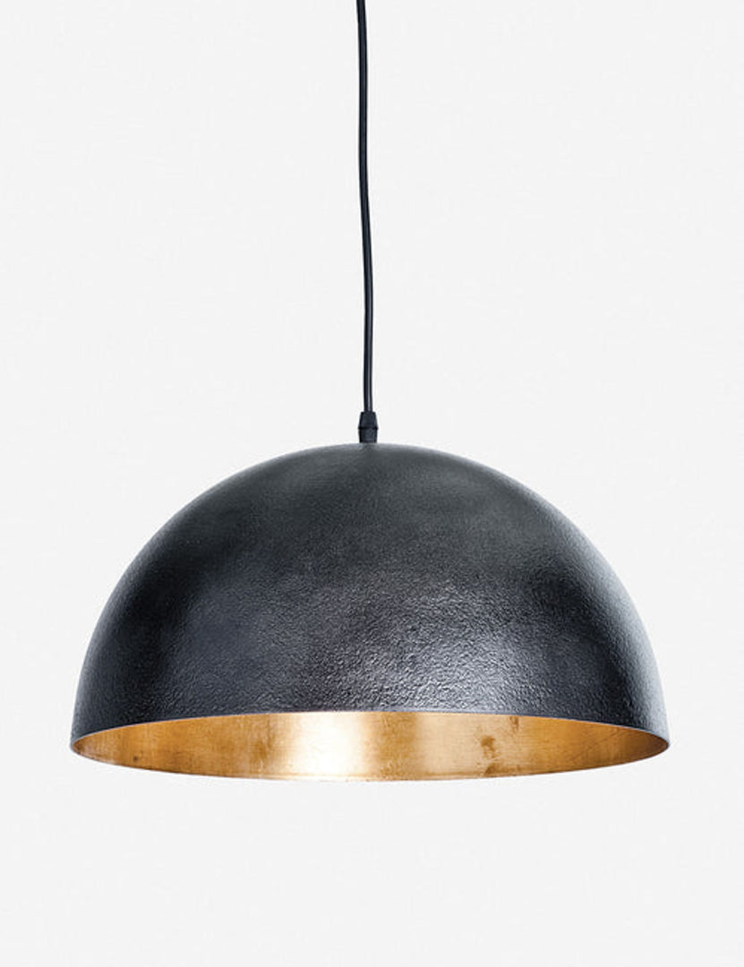 | Sigmund black pendant light with a gold-leaf interior by Regina Andrew