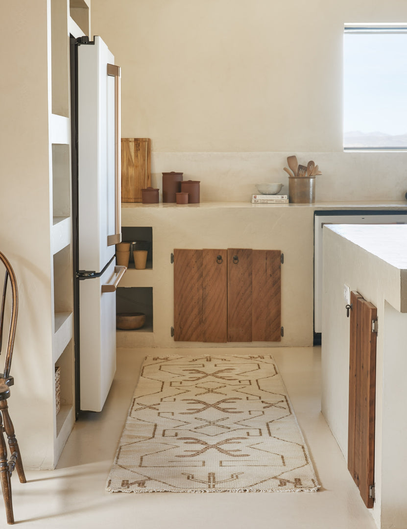 #size::2-6--x-8- | The Evet neutral geometric wool floor rug lays in a neutral kitchen with stone counters.