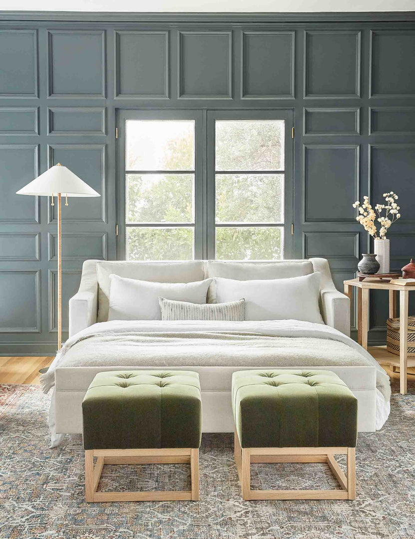 #size::king #color::natural #size::queen | Coniston Natural Linen Sleeper Sofa with its bed pulled out sits in a living room with green accented walls and two green velvet ottomans