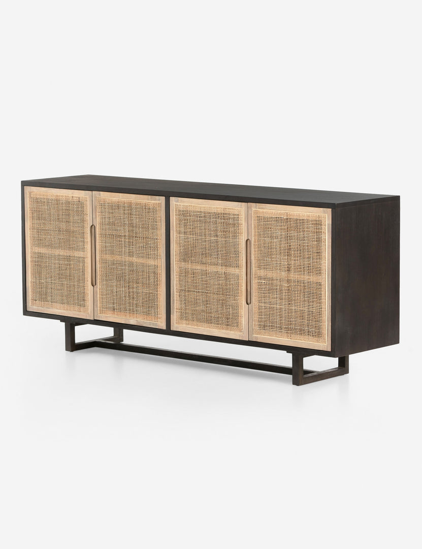 #color::black | Angled view of Margot black natural mango wood sideboard with cane doors.