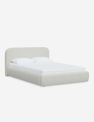 Angled view of the Nabiha White Boucle platform bed