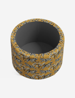 The storage space inside the Kamila tiger golden 24 inch ottoman