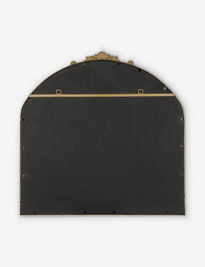 Rear view of the Tulca arched gold mirror with flat bottom edge and traditional scroll detailing.