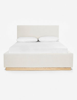 Lockwood white velvet-upholstered bed with a white oak base.