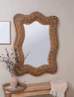 Fintan rustic woven frame mirror handing on wall above console table