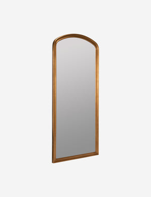 angled view of the Oralie arched antique gold framed full length mirror
