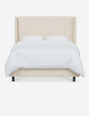 Adara talc linen upholstered bed.