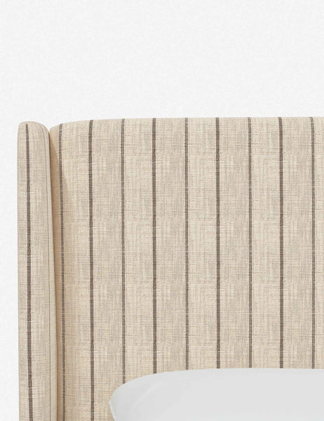 #color::natural-stripe #size::cal-king #size::full #size::king #size::queen #size::twin | Close-up of the subtle winged headboard and trim lines on the Adara natural stripe  linen upholstered bed.
