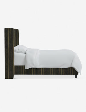 Side view of Adara peppercorn stripe linen upholstered bed.