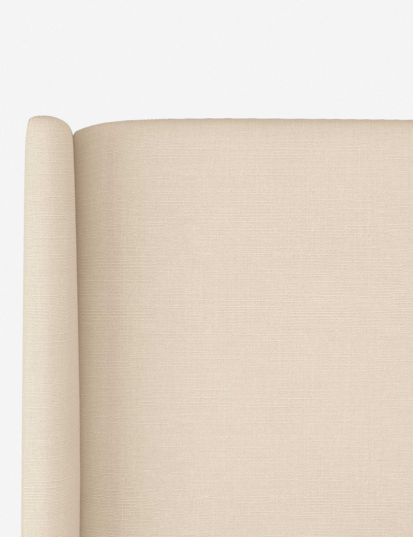 #color::natural-linen #size::twin #size::queen #size::cal-king #size::king #size::full | Close-up of the subtle winged headboard and trim lines on the Adara natural linen upholstered bed.