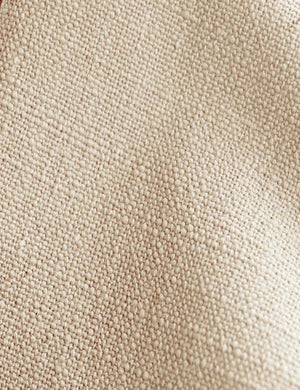 Detailed shot of the natural linen on the Adara natural linen upholstered bed.