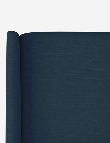 #color::navy-linen #size::cal-king #size::full #size::king #size::queen #size::twin | Close-up of the subtle winged headboard and trim lines on the Adara navy linen upholstered bed.