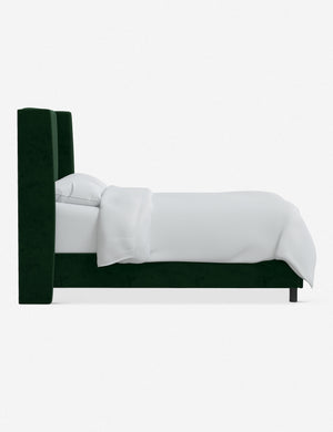 Side view of Adara emerald velvet upholstered bed.