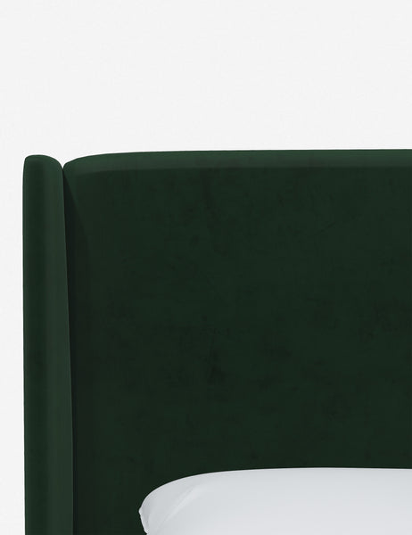 #color::emerald-velvet #size::queen #size::king #size::cal-king #size::twin #size::full | Close-up of the subtle winged headboard and trim lines on the Adara emerald velvet upholstered bed.