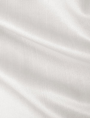 Detailed shot of the white velvet on the Adara white velvet upholstered bed.