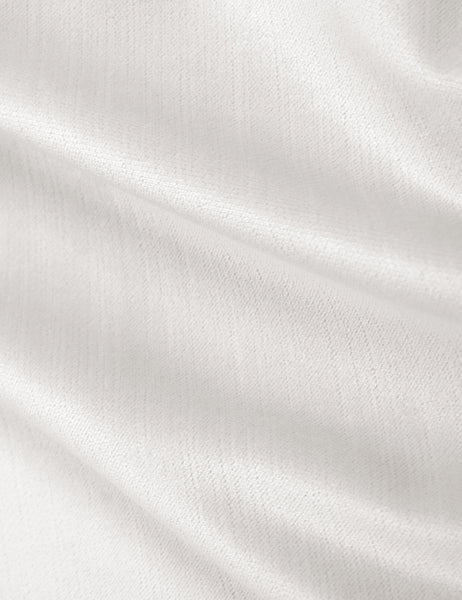 #color::snow-velvet #size::twin #size::full #size::queen #size::king #size::cal-king | Detailed shot of the white velvet on the Adara white velvet upholstered bed. 