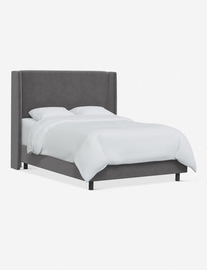 Angled view of Adara gray velvet upholstered bed.
