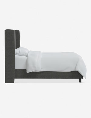Side view of the Adara gray linen upholstered bed.