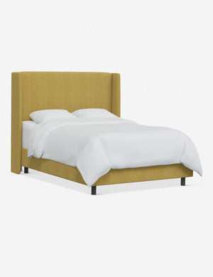 Angled view of the Adara yellow linen upholstered bed.