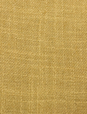 Detailed shot of the yellow linen on the Adara yellow linen upholstered bed.