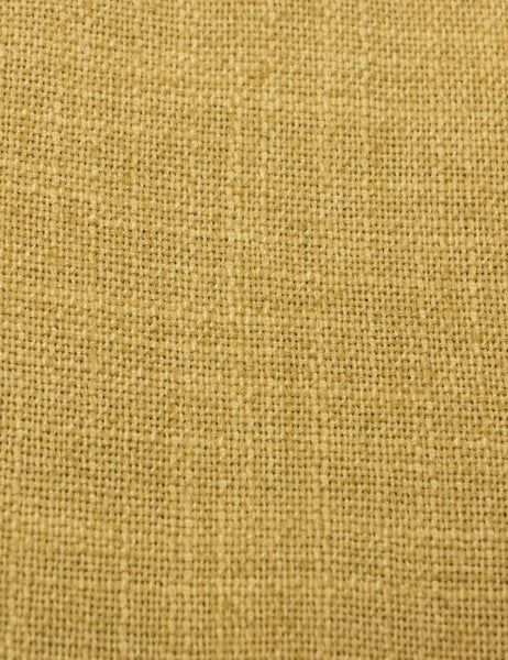 #color::golden-linen #size::twin #size::full #size::queen #size::king #size::cal-king | Detailed shot of the yellow linen on the Adara yellow linen upholstered bed.