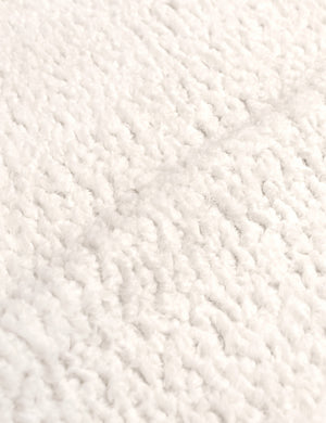 Close-up of the cream sherpa fabric on the Clementine platform bed
