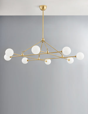 Helia slim frame modern brass chandelier.