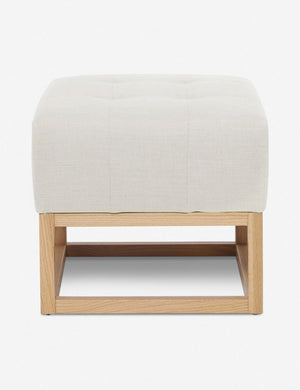 Oyster White Linen Grasmere Ottoman with an upholstered cushion and airy wooden frame by Ginny Macdonald