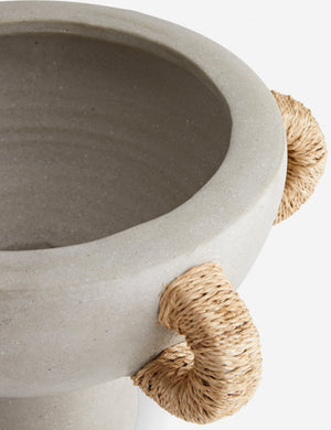Close-up of the right side of the Clyde terracotta centerpiece with jute handles by Arteriors