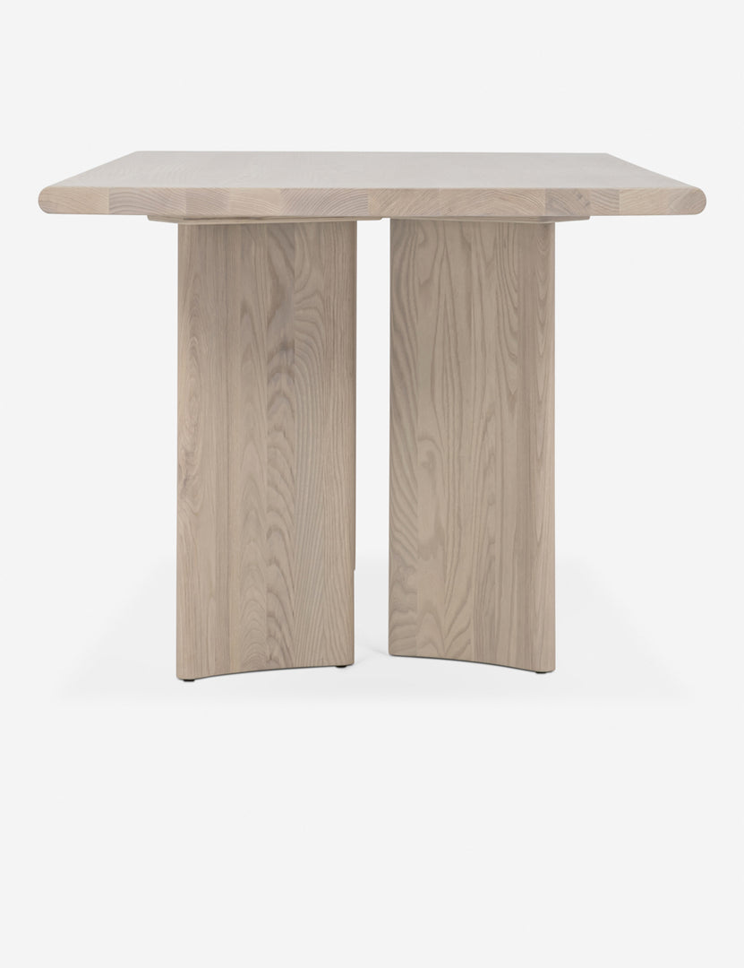 #color::nude #size::78-w | Side view of the Sun at six crest white oak dining table with curved legs