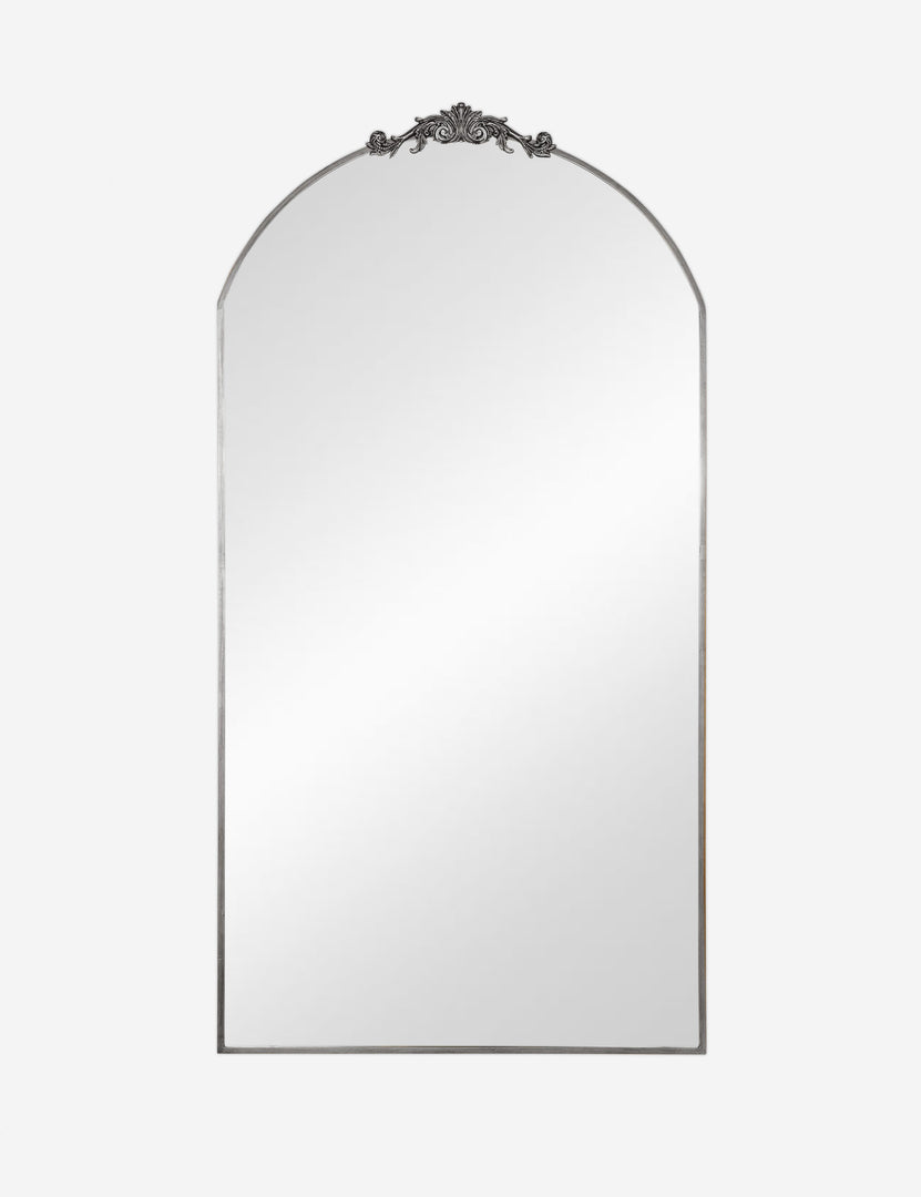 #color::silver | Tulca silver curved standing mirror with flat bottom edge and traditional scroll detailing.