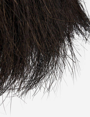 Close-up of the ends of the palm tree fibers on the Paige black plush pendant light