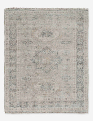 Ismenia distressed sand-toned persian rug with fringed ends