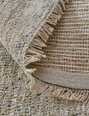 Close-up of the natural fiber fabric and fringed ends on the Ismenia distressed persian rug