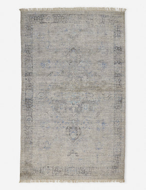 Ismenia distressed slate-toned persian rug with fringed ends
