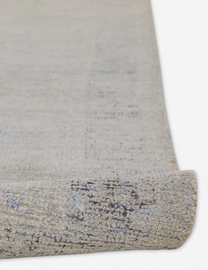 Detailed view of the natural fiber fabric on the Ismenia distressed persian rug