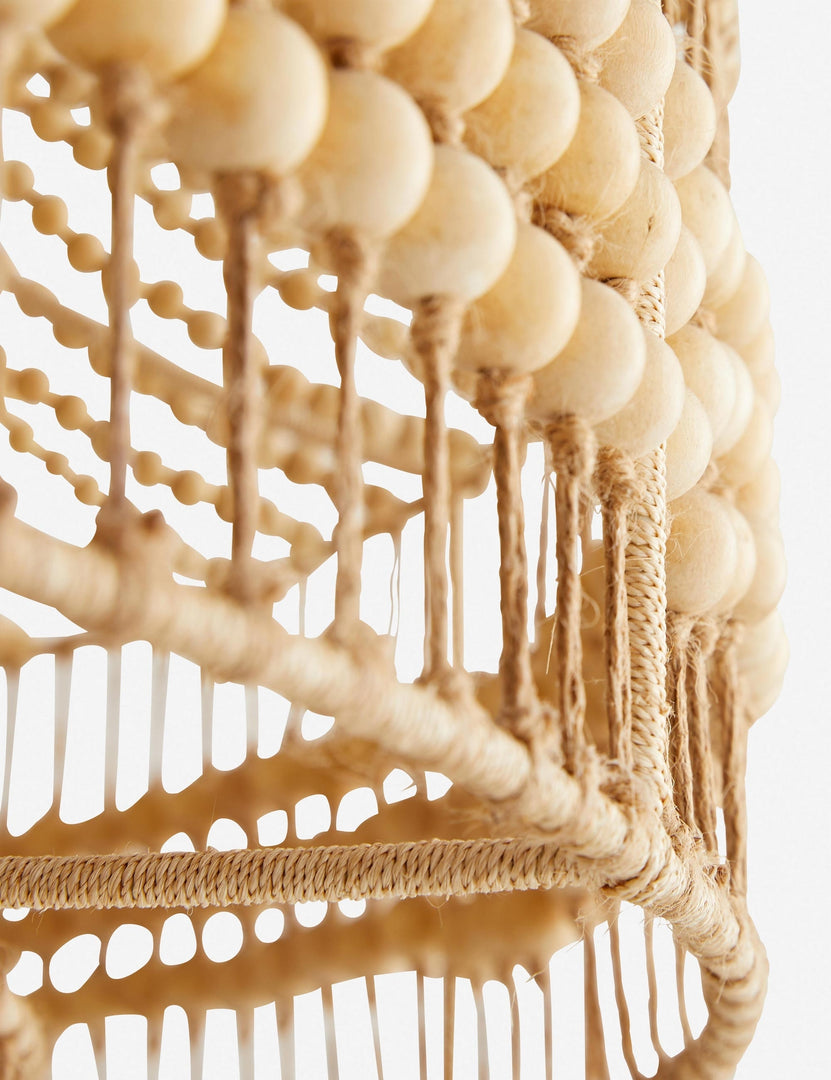 | Close-up of the wooden beads and abaca rope on the bottom of the Tulane open-woven wooden chandelier by Arteriors