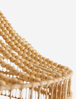 Close-up of the wooden beads and abaca rope on the Tulane open-woven wooden chandelier by Arteriors