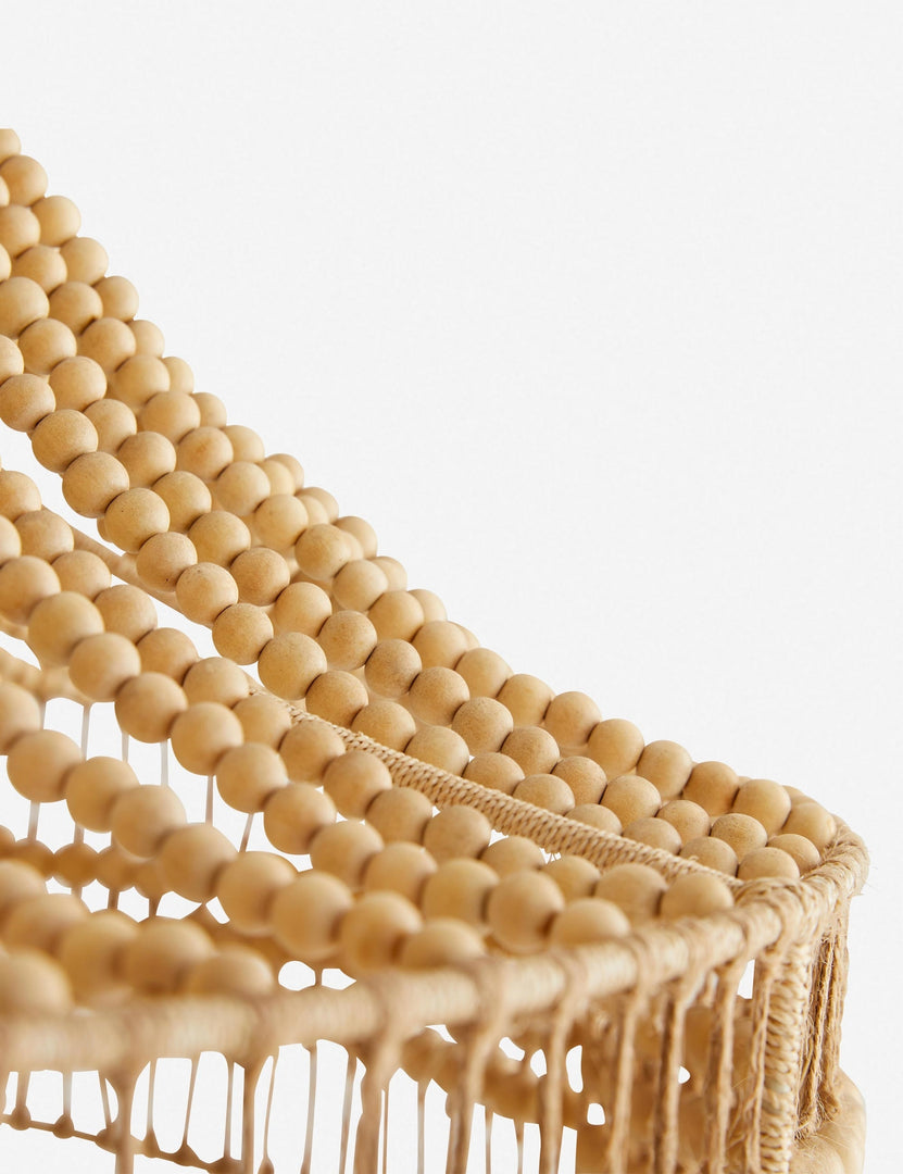 | Close-up of the wooden beads and abaca rope on the Tulane open-woven wooden chandelier by Arteriors