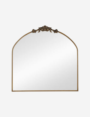 Tulca arched gold mirror with flat bottom edge and traditional scroll detailing.