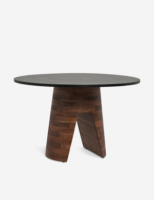 Adler acadia wooden round dining table with a wood grain texture and sculptural base